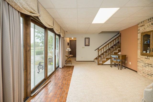 interior space with a drop ceiling