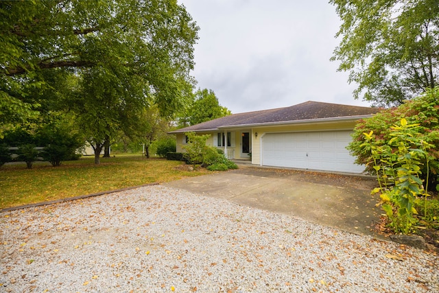 view of front of property featuring a front lawn and a garage