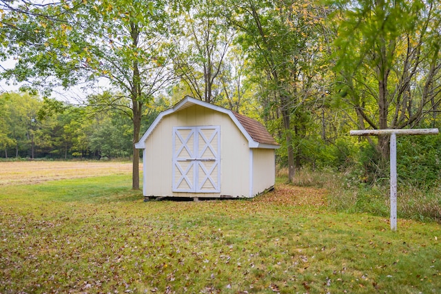 view of outbuilding with a lawn