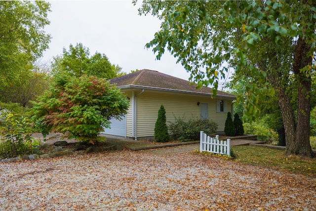 view of property exterior with a garage