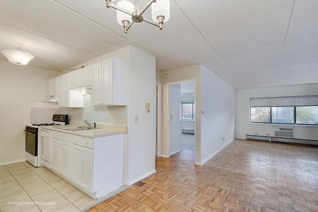 kitchen with white cabinetry, a healthy amount of sunlight, sink, and white range with gas stovetop