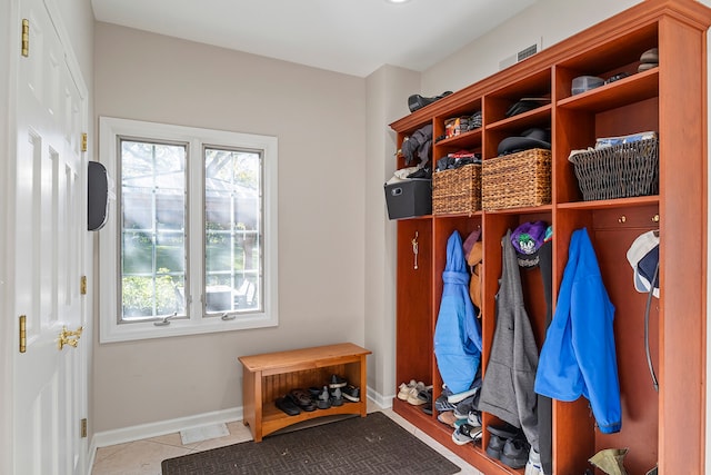 mudroom with light tile patterned flooring