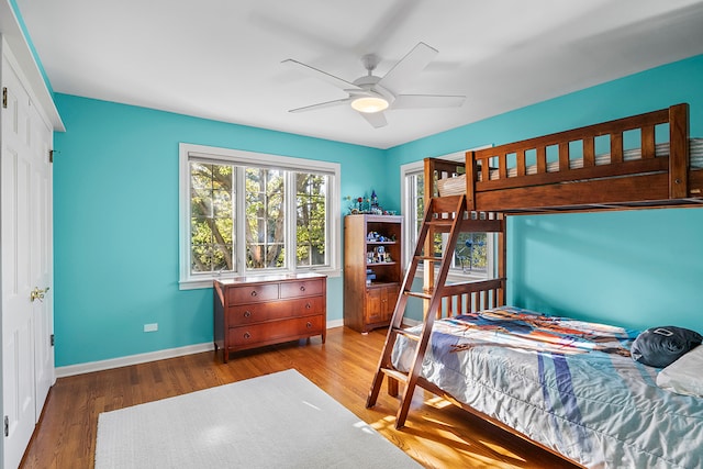 bedroom featuring a closet, ceiling fan, and hardwood / wood-style floors