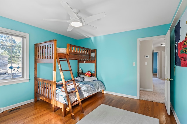 bedroom with hardwood / wood-style floors and ceiling fan