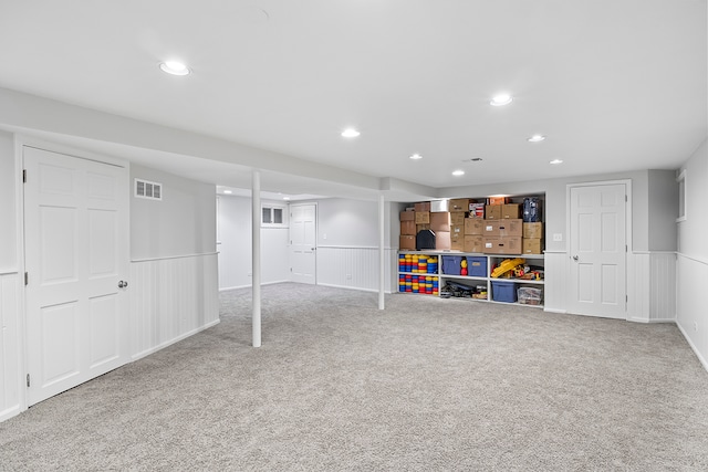 basement featuring carpet flooring