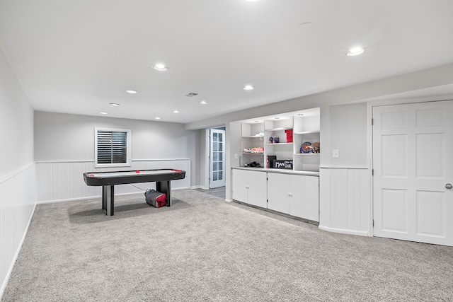 recreation room featuring light carpet