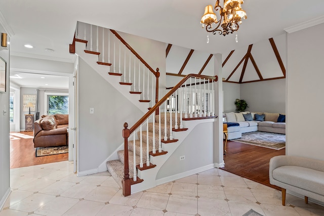 staircase with wood-type flooring, ornamental molding, and a notable chandelier