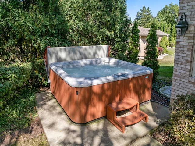 view of patio / terrace featuring a hot tub