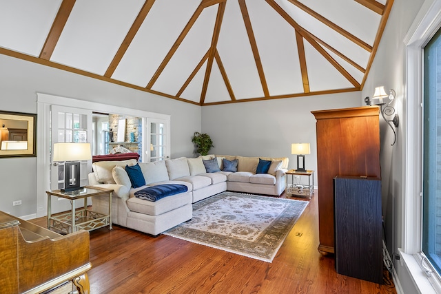 living room featuring beam ceiling, dark hardwood / wood-style flooring, and high vaulted ceiling