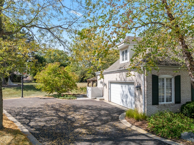 view of side of home featuring a garage