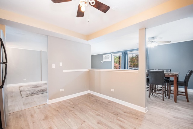 unfurnished room featuring light wood-type flooring and ceiling fan