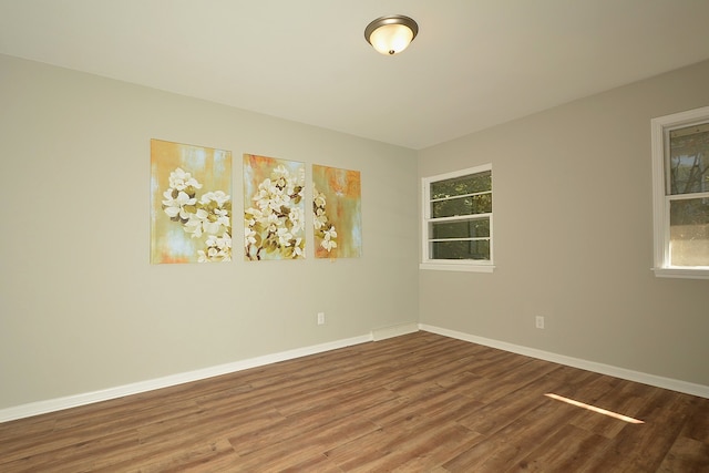 unfurnished room featuring hardwood / wood-style floors