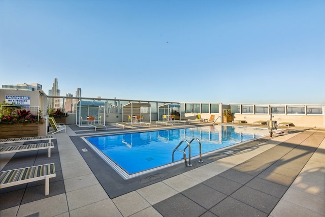 view of swimming pool with a patio