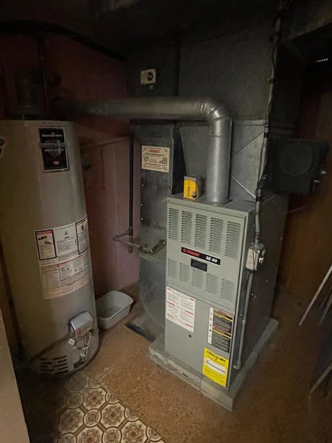 utility room featuring gas water heater