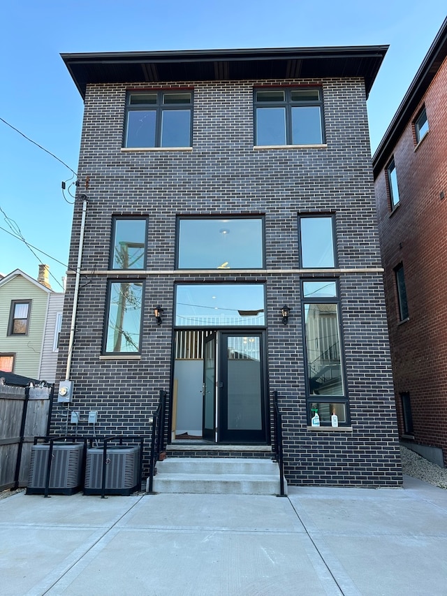 back of property featuring a patio area and central air condition unit