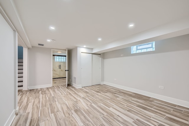 basement featuring light wood-type flooring