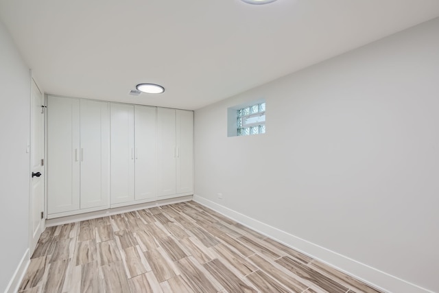 spare room with light wood-type flooring