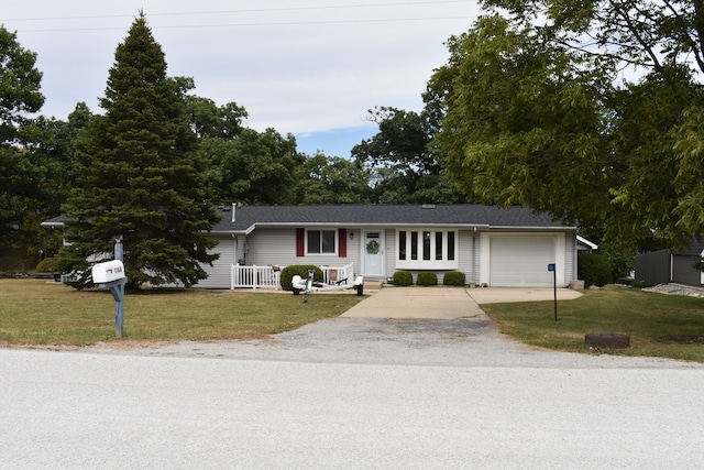 ranch-style home featuring a front yard and a garage