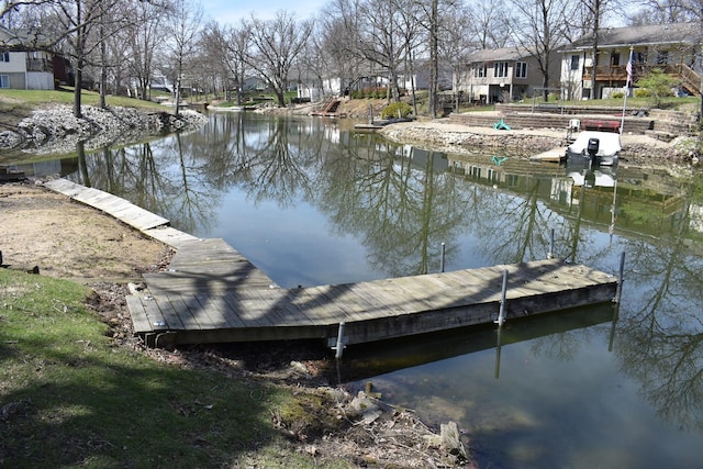 dock area with a water view and a residential view