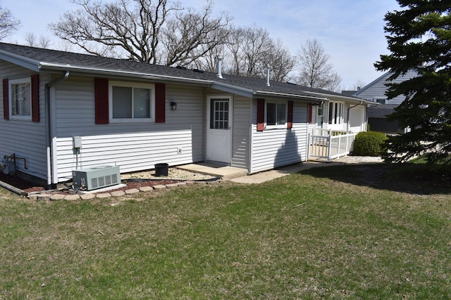 rear view of house with a lawn