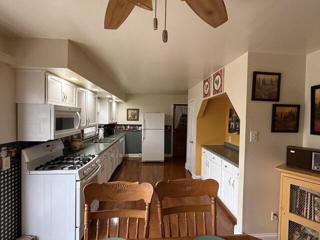 dining room featuring dark hardwood / wood-style floors and ceiling fan