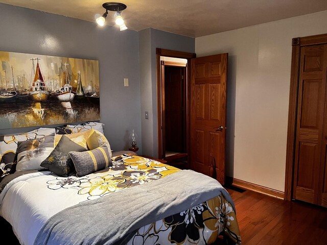 bathroom featuring tile patterned flooring, toilet, and shower / tub combo with curtain