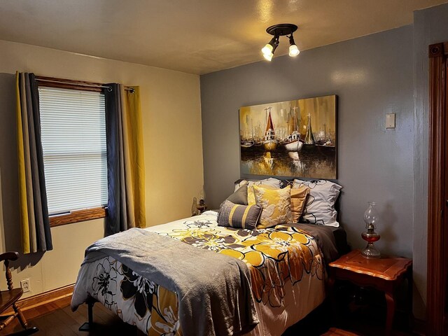 bedroom with hardwood / wood-style floors