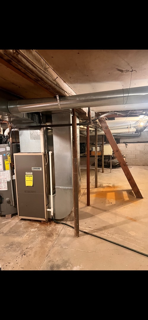 basement featuring gas water heater