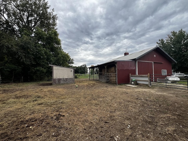 view of outbuilding featuring an outdoor structure and an exterior structure