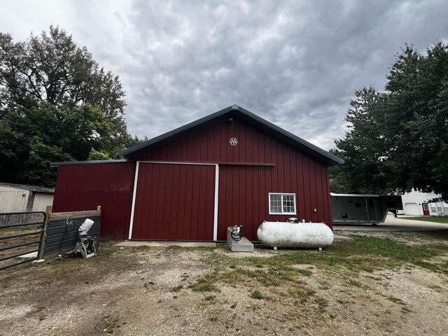 view of pole building featuring fence