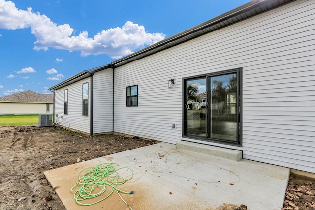 exterior space with a patio area and central AC