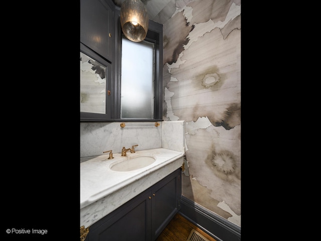 bathroom featuring vanity and hardwood / wood-style floors