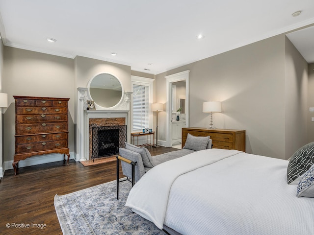 bedroom with ornamental molding and dark wood-type flooring