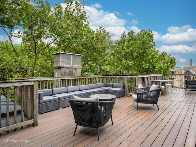 wooden terrace with outdoor lounge area