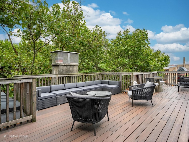 wooden deck featuring an outdoor living space