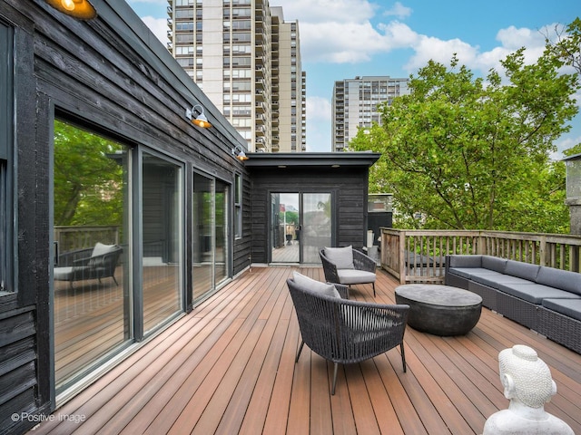 deck featuring a city view and an outdoor hangout area