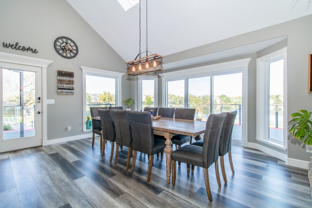 dining area featuring dark hardwood / wood-style flooring, high vaulted ceiling, and a healthy amount of sunlight