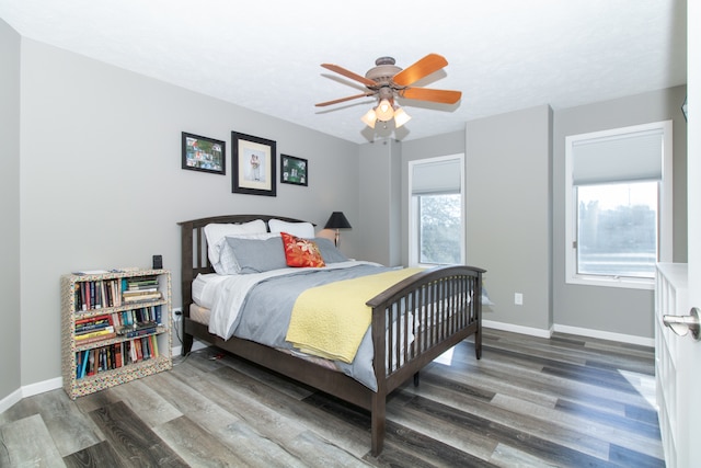 bedroom featuring ceiling fan and dark hardwood / wood-style flooring