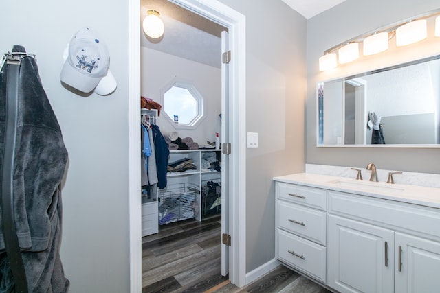 bathroom featuring vanity and hardwood / wood-style flooring