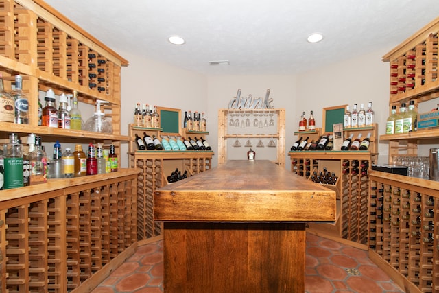 wine room featuring indoor bar