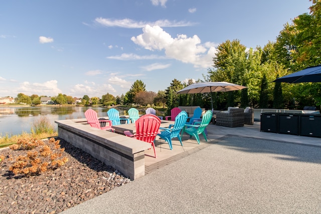 view of patio featuring a water view