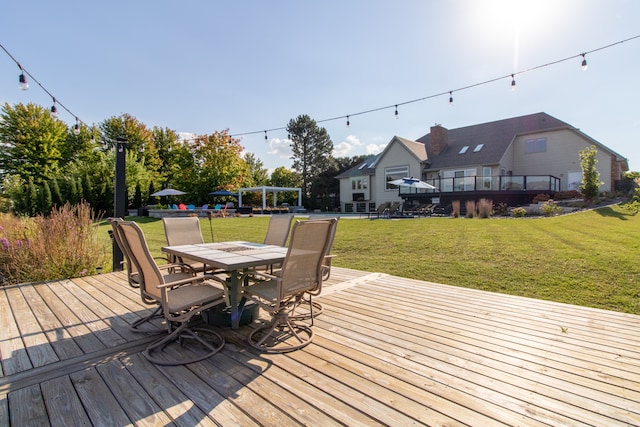 wooden deck featuring a yard