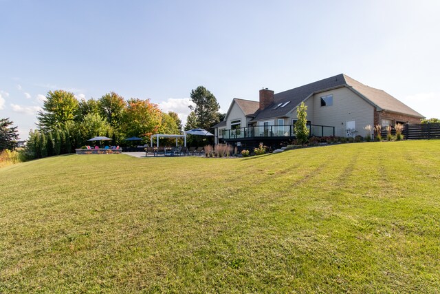 view of yard with a wooden deck