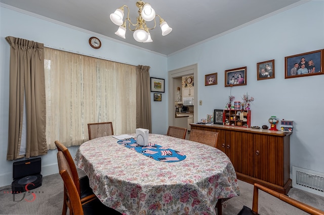 carpeted dining area with ornamental molding and a chandelier