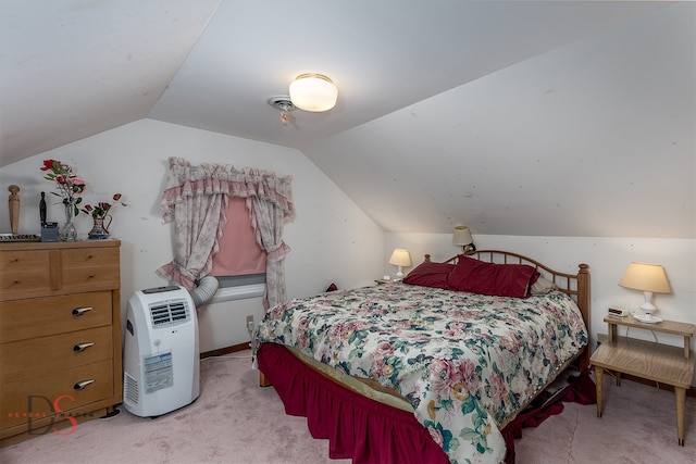 carpeted bedroom with lofted ceiling