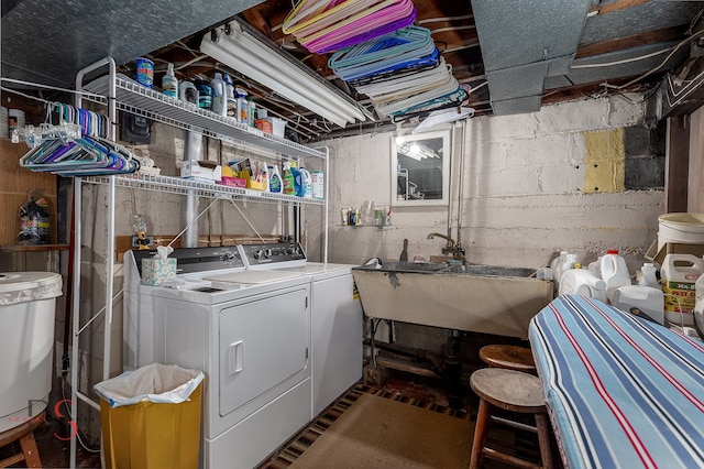 laundry area with washer and dryer and sink