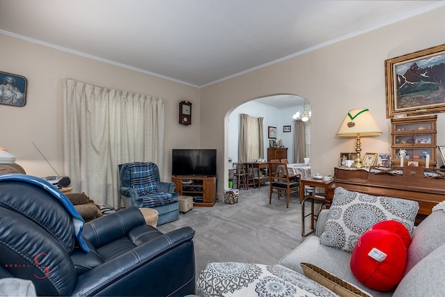 carpeted living room with ornamental molding and a chandelier