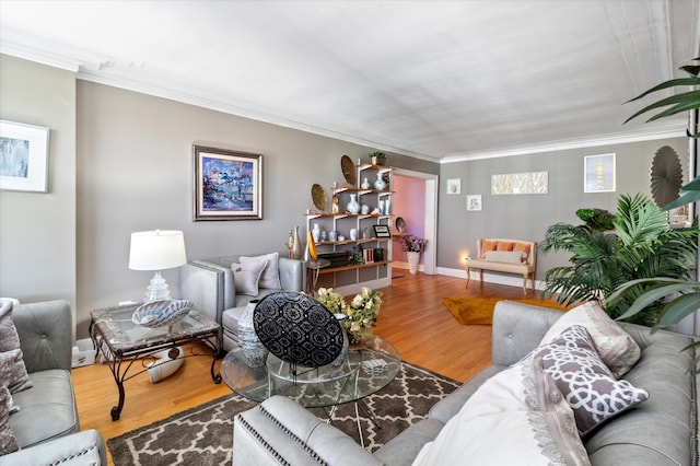 living room featuring hardwood / wood-style flooring and crown molding