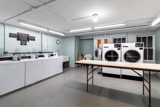 washroom featuring washer and clothes dryer