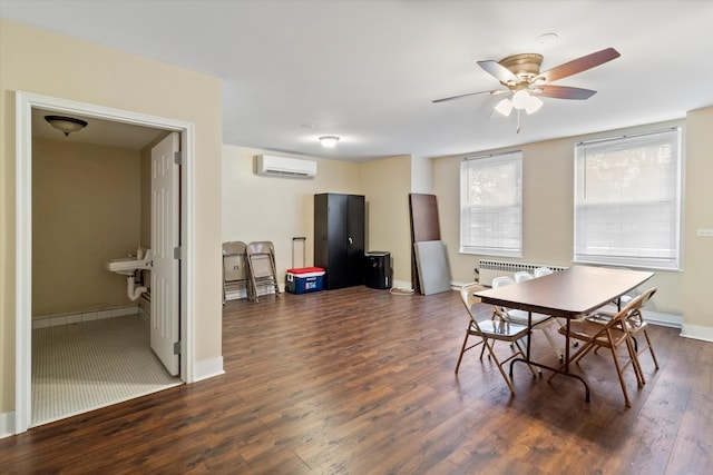 dining room featuring dark hardwood / wood-style floors, ceiling fan, and a wall unit AC